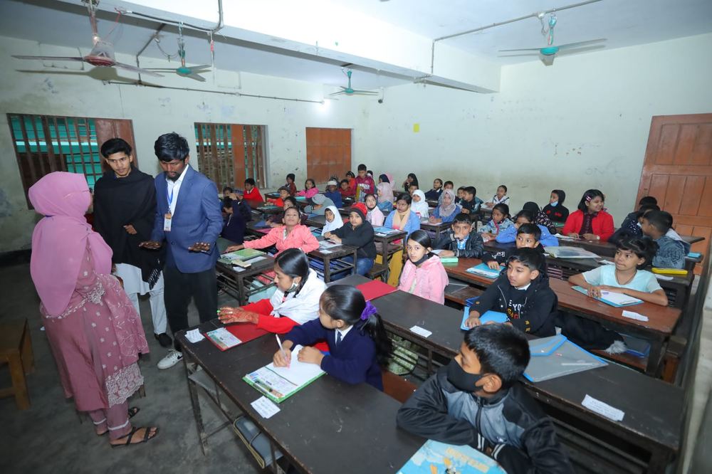 Scholarship exam, students at desks in classroom